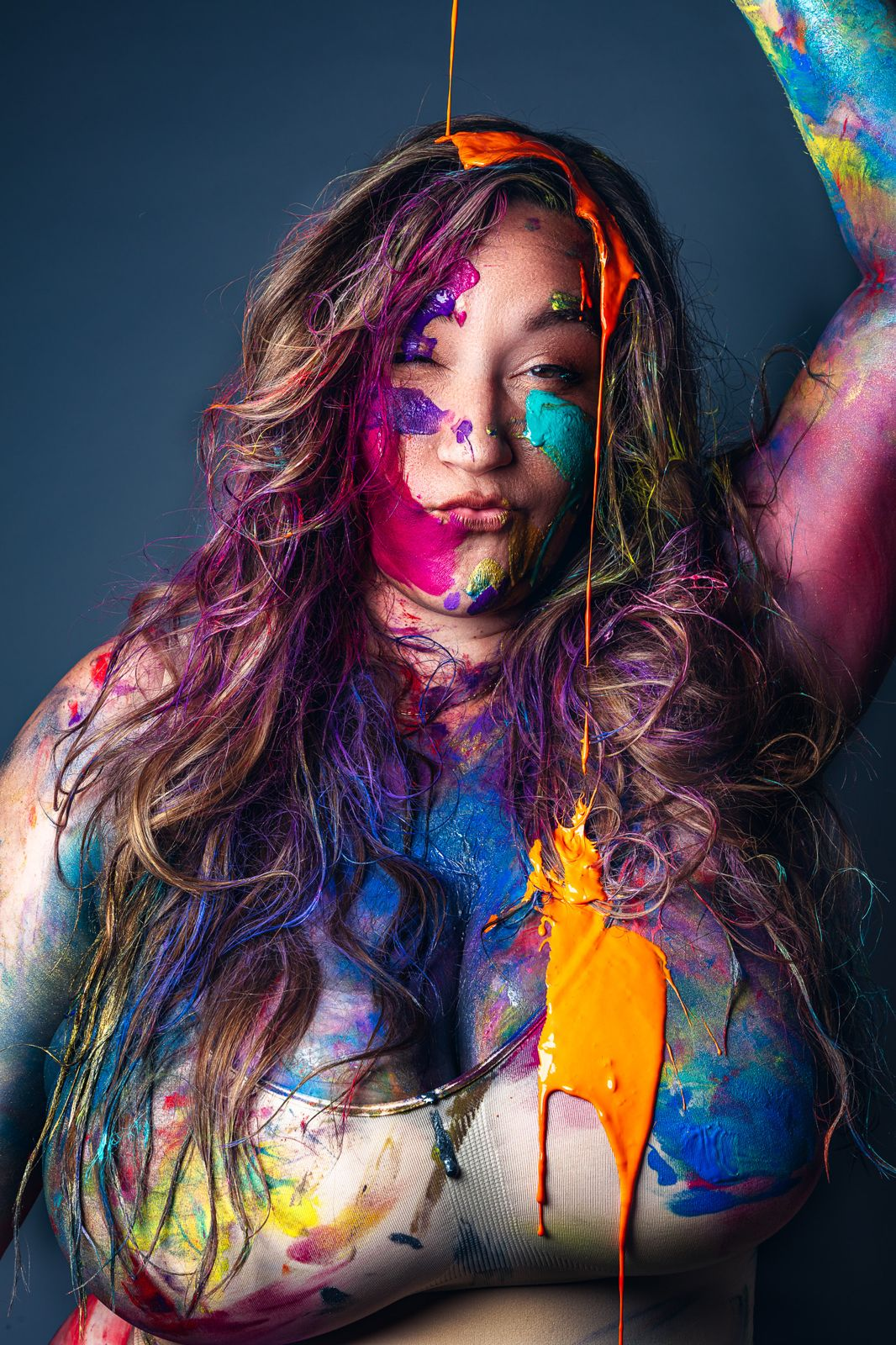 Portrait covered in bright paint